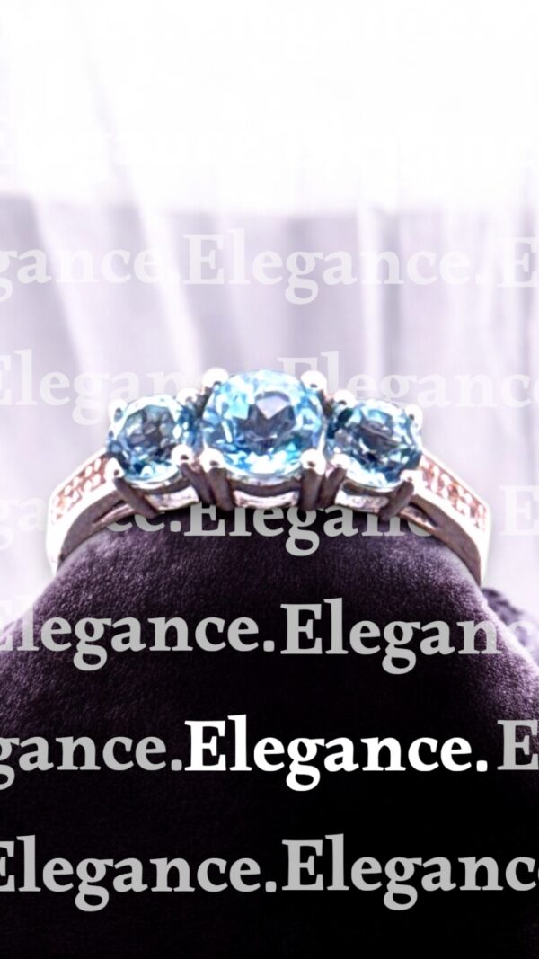 0.67 Carat Round Swiss Blue Topaz with White Topaz Accent 3 Stone Sterling Silver Ring - Image 4