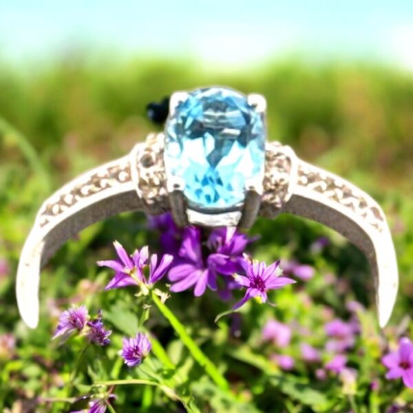 1.02 Carat Swiss Blue Topaz with White Topaz Accent Stones in Oval Center Design Sterling Silver Ring - Image 2