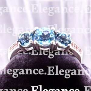 0.67 Carat Round Swiss Blue Topaz with White Topaz Accent 3 Stone Sterling Silver Ring Blue Topaz Platinum Jewelers MS