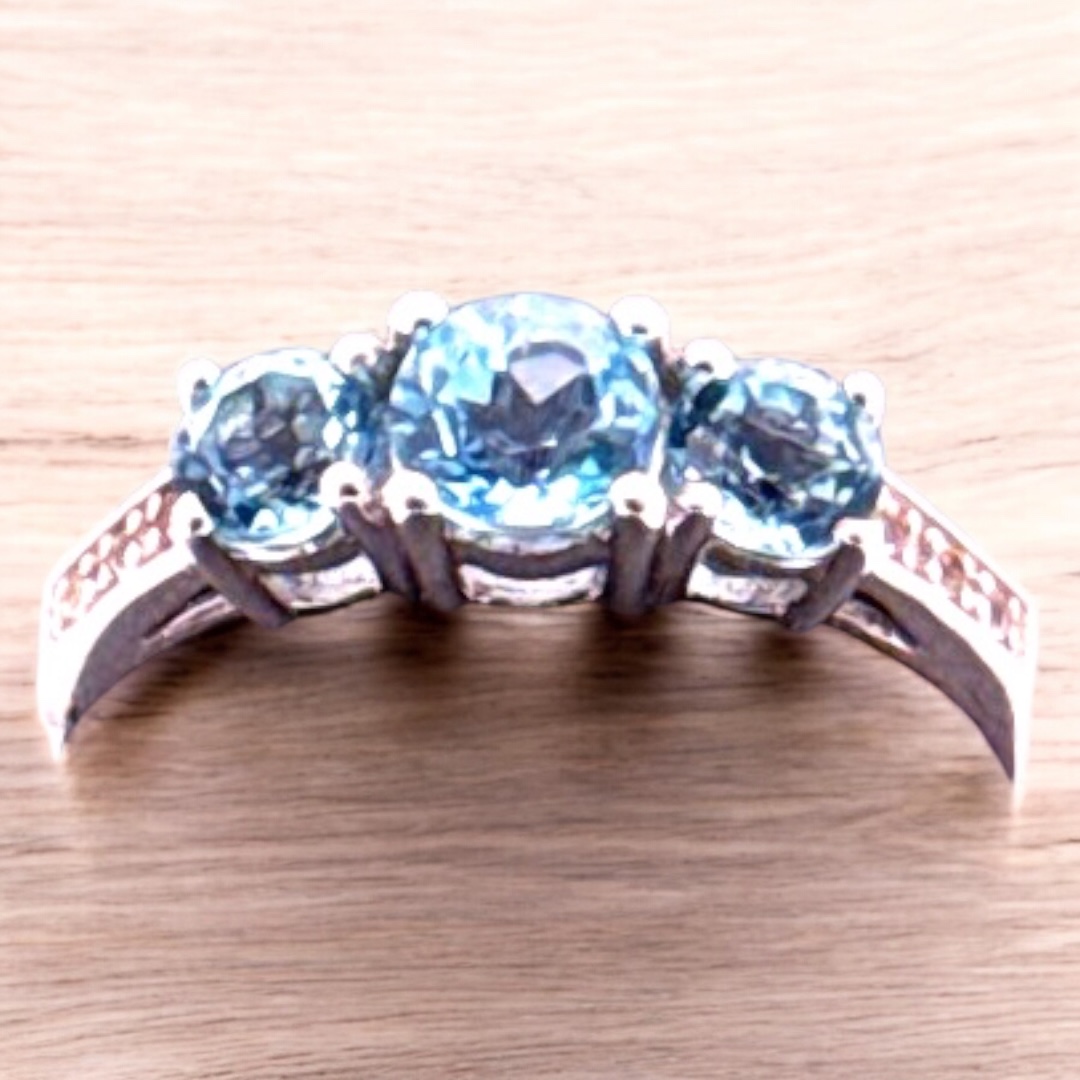 0.67 Carat Round Swiss Blue Topaz with White Topaz Accent 3 Stone Sterling Silver Ring Blue Topaz Platinum Jewelers MS