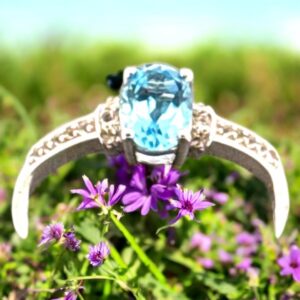 1.02 Carat Swiss Blue Topaz with White Topaz Accent Stones in Oval Center Design Sterling Silver Ring Blue Topaz Platinum Jewelers MS