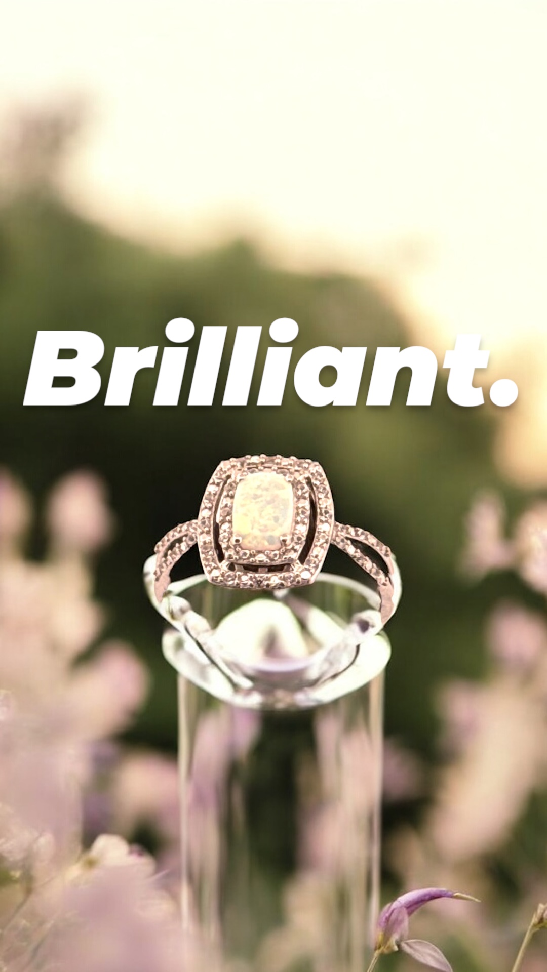 Opal Center Stone with White Zircon Halo Design in Sterling Silver Opal Platinum Jewelers MS